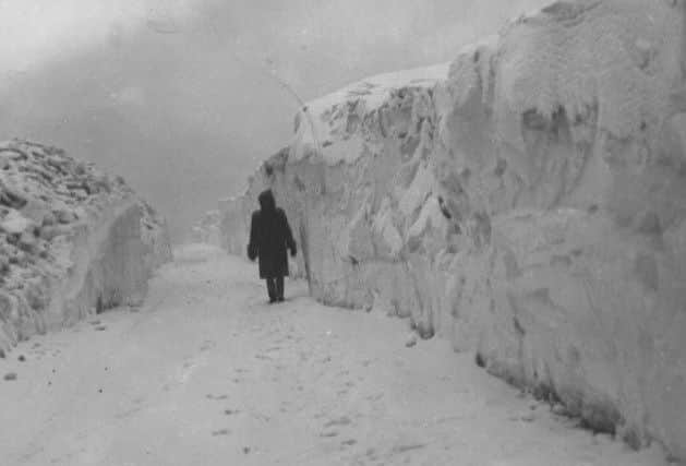 HUGE DRIFTS: Mercury reader George Harris submitted this picture of the incredible volume of snow which fell at Farley Hill in Matlock in February 1947.