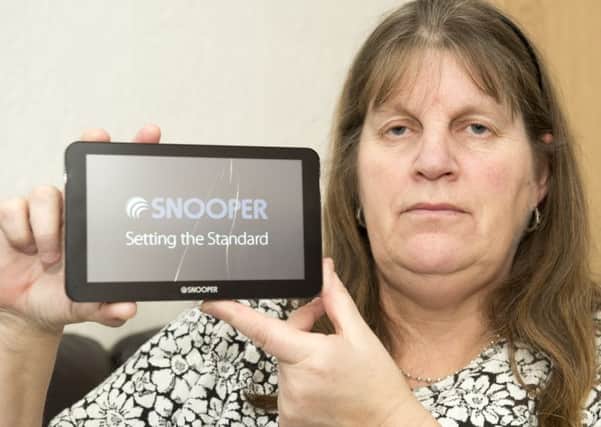 Jill Wolstenholme from Sheffield with the broken Snooper Sat Nav they wont repair after the mounting system failed