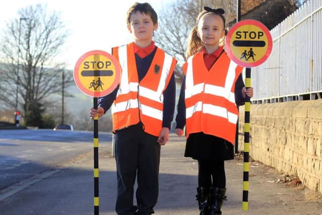 Pupils at Loxley Primary School are campaigning for a new lollipop person to help them cross the road safely