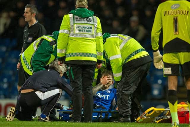Chesterfield vs Swindon Town - Daniel Jones is stretchered off through Injury - Pic By James Williamson