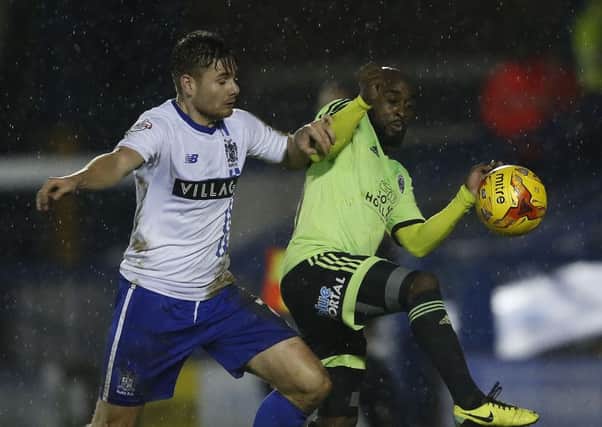 Joe Riley, left, in action for  of Bury against United's Jamal Campbell Ryce a year ago  - Pic Simon Bellis/Sportimage