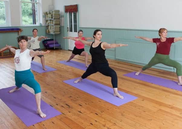 Frances  Homewood and her team practice yoga at the Sheffield Yoga Centre.