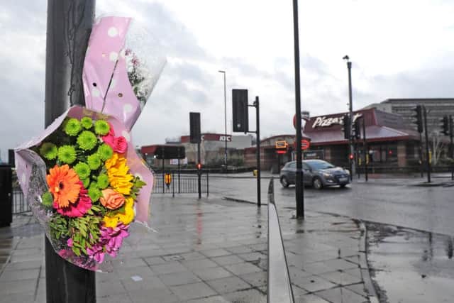 Flowers left at the scene at the junction of Penistone Road and Bradfield Road where a man died after being hit by a police car.