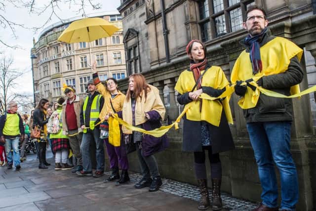 Campaigners form a human chain around Sheffield Town Hall in protest at the council's tree felling policy