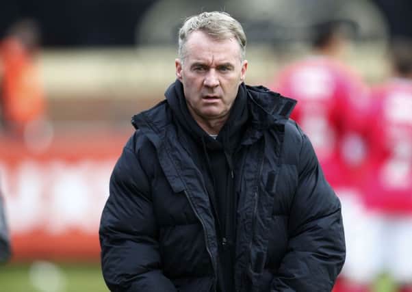 John Sheridan has gone back to Oldham Athletic for a third time as permanent manager
