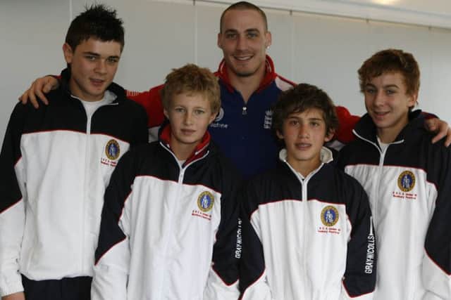 Joe Root as a youngster with England's Simon Jones