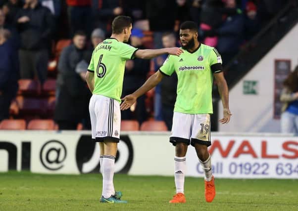 Chris Basham of Sheffield Utd and Ethan Ebanks-Landell of Sheffield Utd discuss the third goal during the English League One match at Bank's Stadium, Walsall. Picture date: January 14th, 2017. Pic Simon Bellis/Sportimage