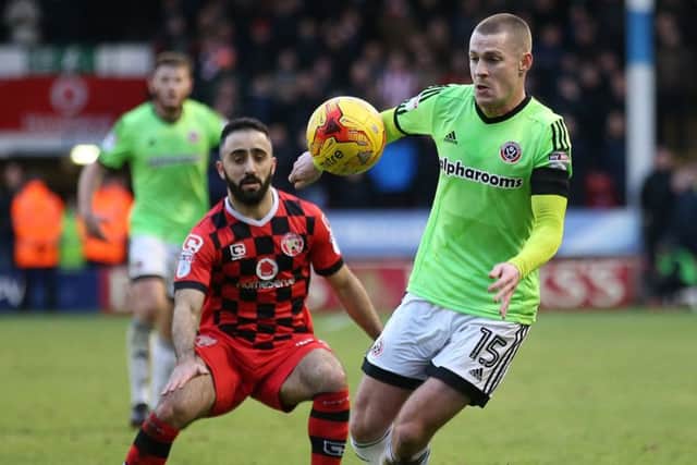 Paul Coutts of Sheffield Utd and Erhun Oztumer of Walsall during the English League One match at Bank's Stadium, Walsall. Picture date: January 14th, 2017. Pic Simon Bellis/Sportimage