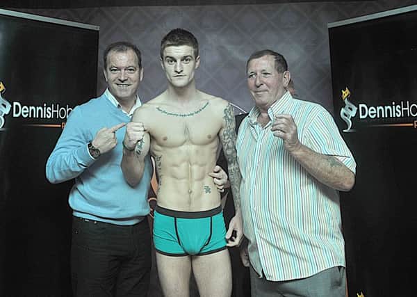 Boxer Steve Swinburn , with Dennis Hobson senior and junior