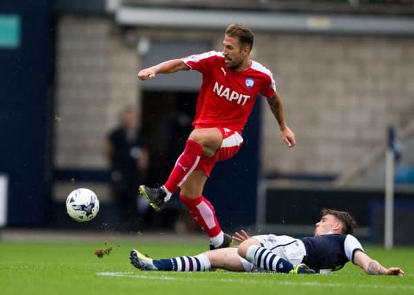 Millwall vs Chesterfield - Angel Martinez sends the ball forward - Pic By James Williamson