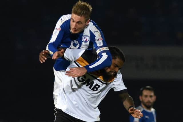 Picture Andrew Roe/AHPIX LTD, Football, EFL Sky Bet League One, Port Vale v Chesterfield, Vale Park, 30/12/16, K.O 7.45pm
Chesterfield's Gary Liddle wins an aerial battle against Port Vale's Anthony Grant
Andrew Roe>>>>>>>07826527594