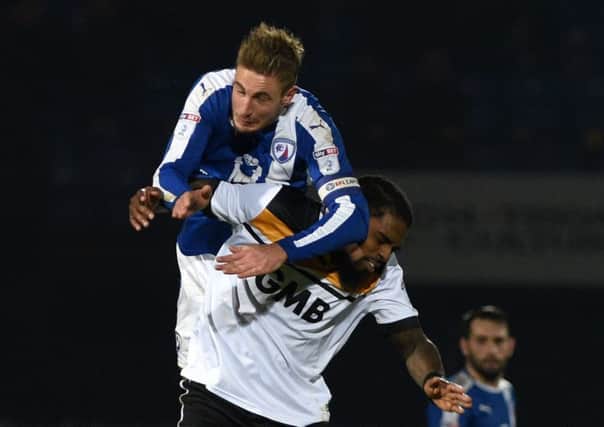 Picture Andrew Roe/AHPIX LTD, Football, EFL Sky Bet League One, Port Vale v Chesterfield, Vale Park, 30/12/16, K.O 7.45pm

Chesterfield's Gary Liddle wins an aerial battle against Port Vale's Anthony Grant

Andrew Roe>>>>>>>07826527594