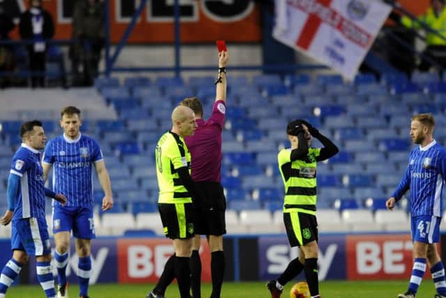 Huddersfield Town's Jack Payne is sent off for a challenge on Sam Hutchinson