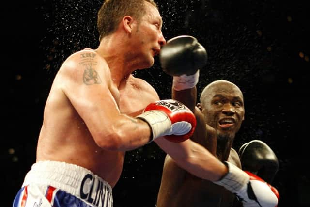 Antonio Tarver, right, follows through on a punch to Clinton Woods, of England, during the sixth round of the IBF/IBO Light Heavyweight Championship boxing match on Saturday, April 12, 2008, in Tampa, Fla.