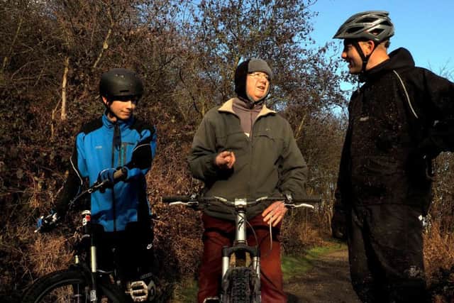 Parkwood Springs: Richard Talbot and son Ben (left) talking to Ray Swift about his off road cycling at Parkwood Springs in the 1940s