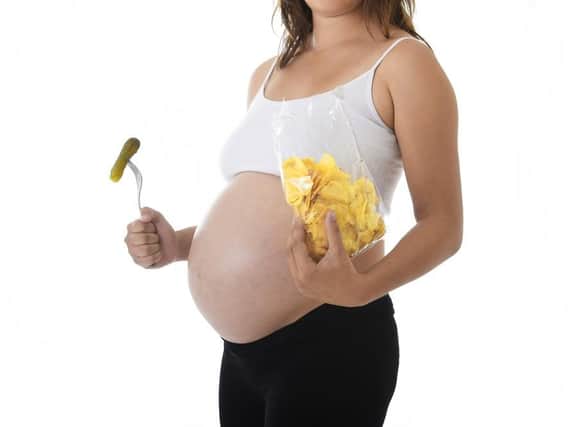 Mums who pile on pounds while eating for two dont harm unborn child