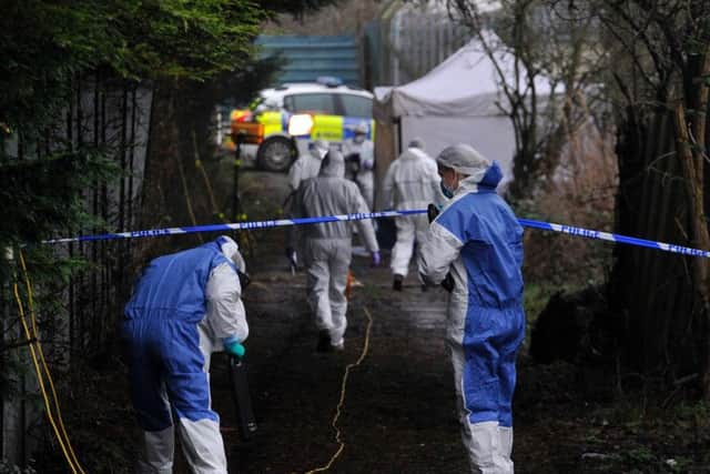 Forensic investigators arrive at the scene in Dinnington, where the body of a 16 year old girl was been found on an alleyway. Picture: SWNS