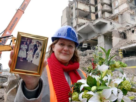 Sheffield Council leader Julie Dore holds up her wedding photo at the Grosvenor House Hotel, where she had her reception 30 years ago. The hotel is being demolished to make way for Sheffield Retail Quarter.
