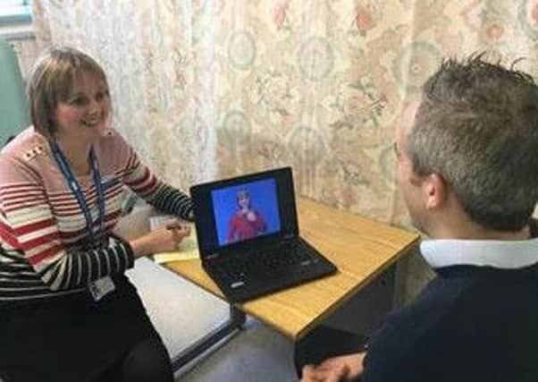 A sign language interpreting service available at any time for deaf patients is being rolled out at Sheffield Teaching Hospitals.