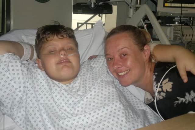 Jack with his mum Rebecca in hospital