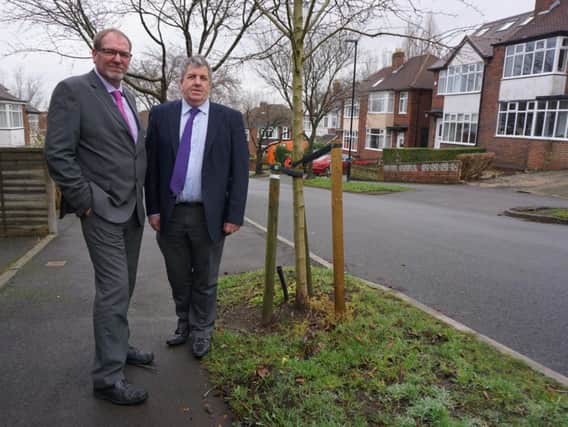 Amey operations director Darren Butt and Sheffield Council's cabinet member for environment Bryan Lodge with one of the new trees planted under the Streets Ahead programme.