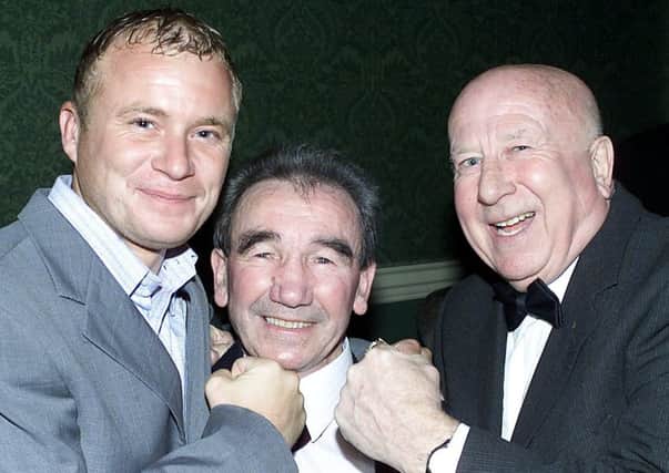 Local former boxer Billy Calvert is caught out by Coronation Street's Steve Arnold and Local ex-Boxers Chairman Harry Carnall. (27/2/04)