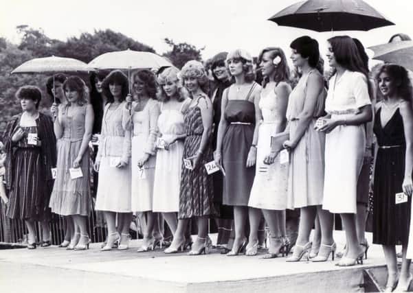 Sheffield Motor Show & Family Gala
Graves Park, Sheffield
Picture shows competitors in the Miss Motor Show contest standing in the rain.... 18th July 1981