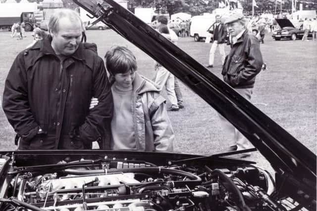 Sheffield Motor Show & Family Gala
Graves Park, Sheffield - 9 June 1991
Mr Don Fairey and his son Ian, aged 10, of Little Norton Lane, Sheffield, pictured inspecting the engine of a Jaguar XJS V12 on show by Hatfields of Sharrow Lane, Sheffield