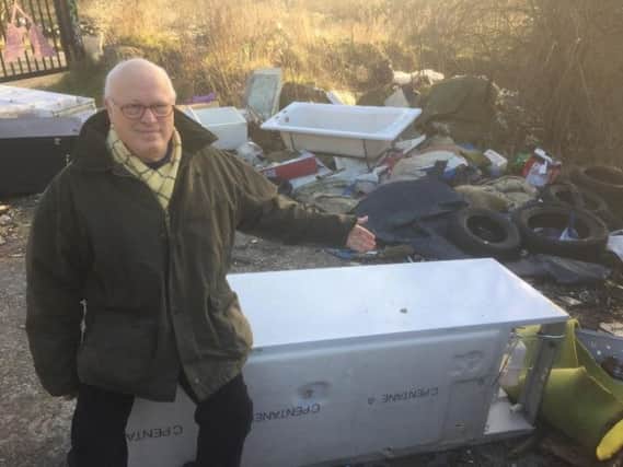 Andrew Flower, chairman of the Federation of Small Businesses South Yorkshire branch, at a fly-tipping spot in Douglas Road, Sheffield