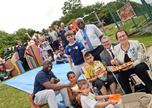 The High Sheriff of Sheffield Julie MacDonald and her consort Neil MacDonald, pictured with playworkers and childrens as they visited Pitsmoor Adventure Palyground's by the Beach Play day.  Picture: Marie Caley NSST Pitsmoor MC 1