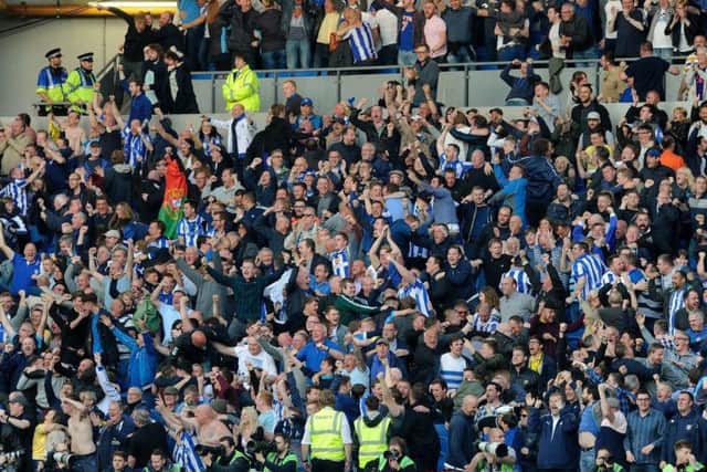 Sheffield Wednesday fans celebrating at the Amex Stadium in the play-off semi-final second leg last season