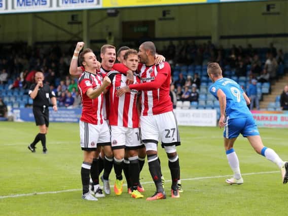Billy Sharp and his team mates after he scored against Gillingham earlier this season