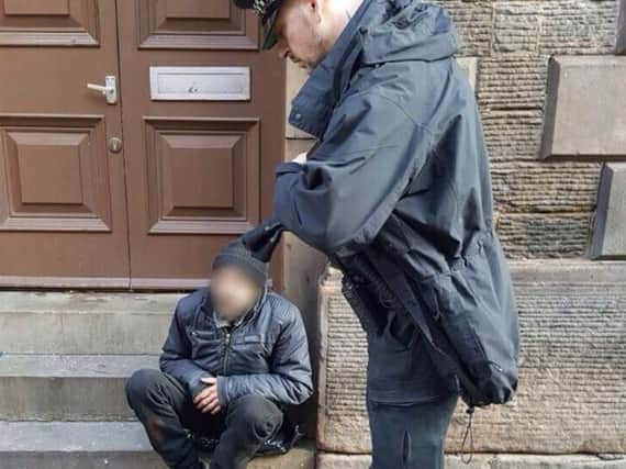 Police officers are tackling begging in Rotherham