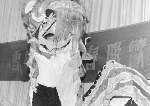 Chinese New Year celebrations at Myrtle Springs School East Bank Road Arbourthorne Dragon dancers perform their ritual dance on stage - 1990