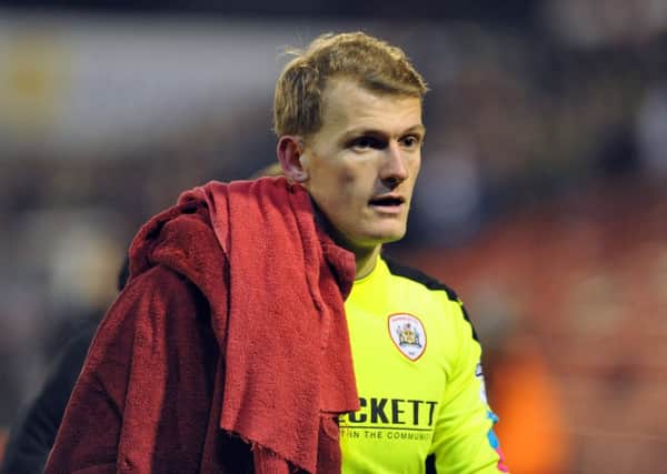 Barnsley goalkeeper Adam Davies has extended his deal until the summer of 2019