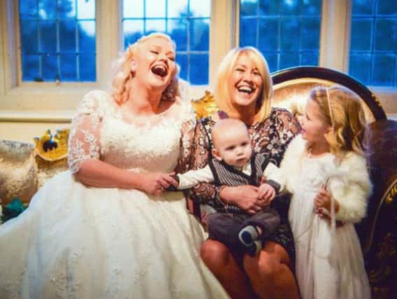 Kate Dunn on her wedding day with her mum Angela, son Seb and niece Poppie