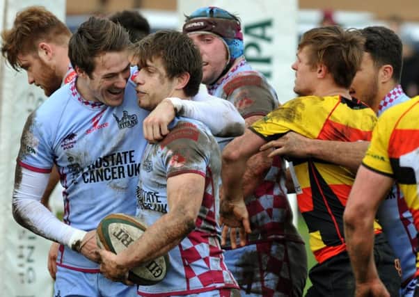 Rotherham Titans' George Tresidder is congratulated after scoring a  try against Richmond .