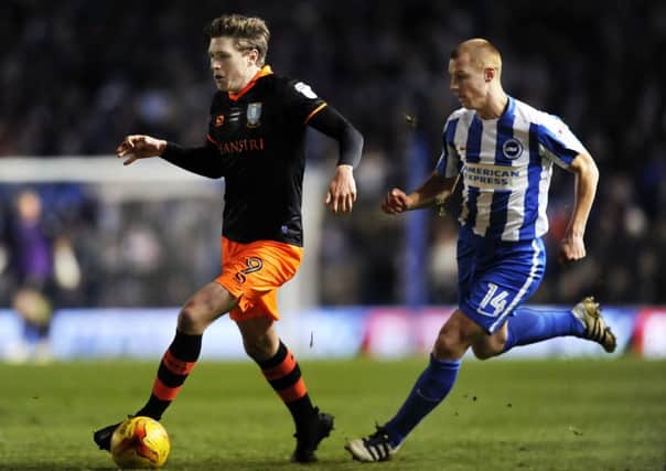 Owls Adam Reach gets away from Albion's Steve Sidwell....Pic Steve Ellis