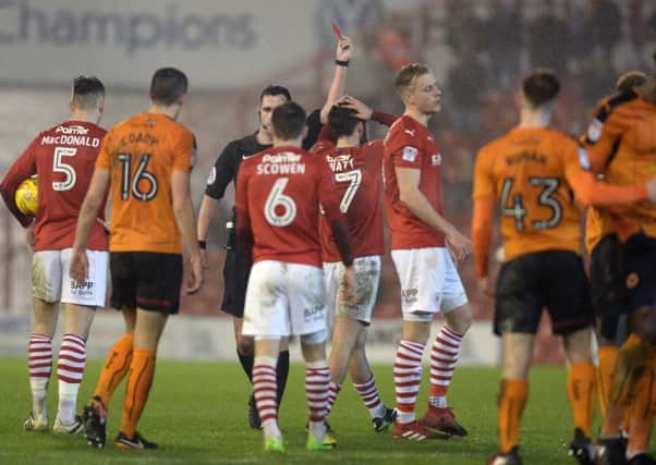Alex Mowatt is sent off by referee Christopher Kavanagh in his first game playing for Barnsley. 
Picture Bruce Rollinson