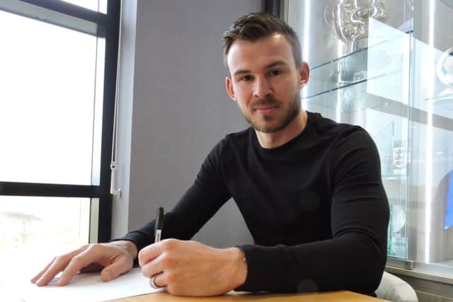 Andy Butler signs his new deal with Doncaster Rovers