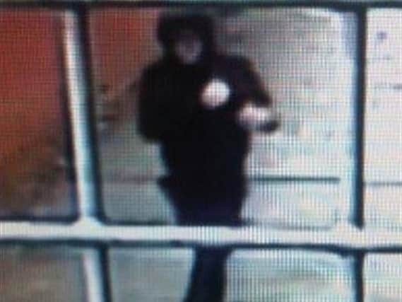 CCTV of a man suspected to have snatched a pensioner's bag.