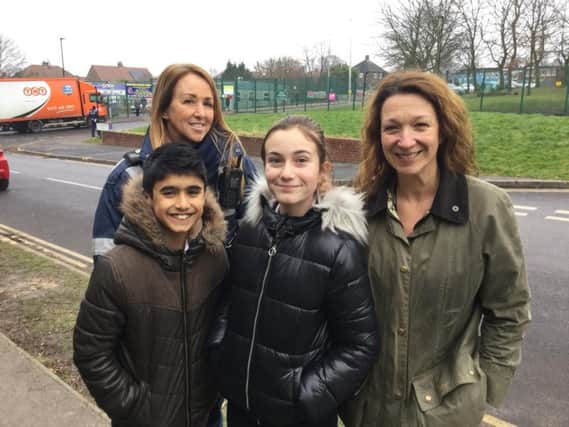 Athelstan Primary School deputy headteacher Lisa Watson (far right) with parking enforcement officer Tracy Bingham and students Sameer (left) and Ellys (centre)
