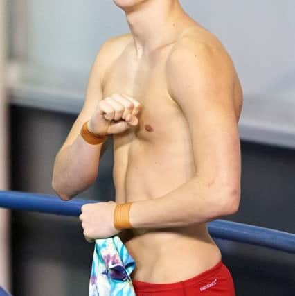 City Of Sheffield Diving Club's Freddie Woodward smiles and clenches his fist during the mens 3m dive final