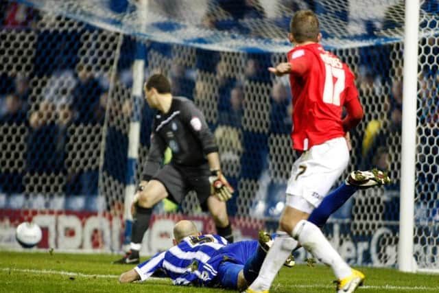 Jordan Rhodes beats Owls keeper Stephen Bywater for his hat-trick goal