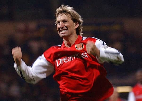 Tony Adams was a proper defender. I loved his style