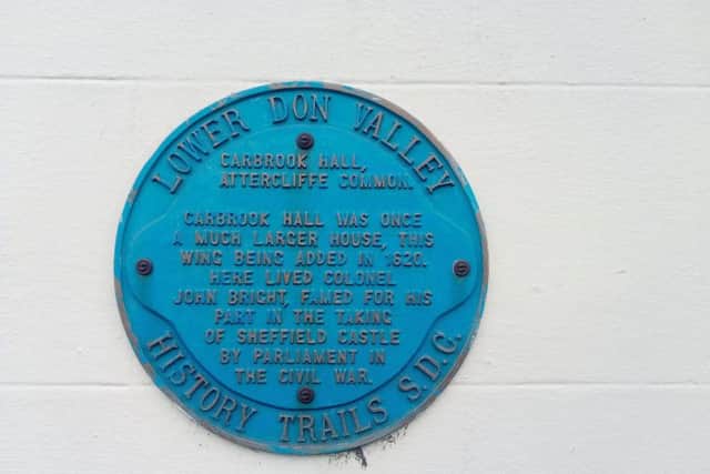A plaque attests to the building's history