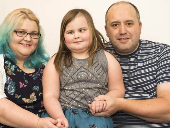 Mum Lara and dad Mark have set up a fundraising so the family can stay together while Amber has her treatment in Oklahoma. Picture: Dean Atkins/The Star