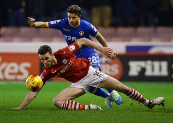 Marley Watkins and Gaetano Berardi challenge for the ball.
Barnsley FC  v Leeds United.  SkyBet Championship. Oakwell.  21 January 2017.  Picture Bruce Rollinson