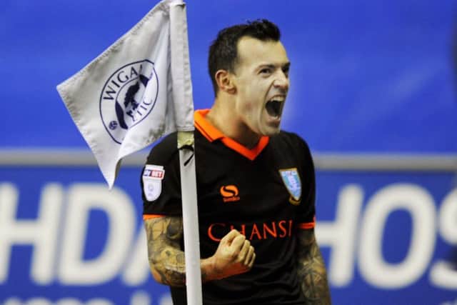 Ross Wallace celebrates netting the only goal of the game for the Owls