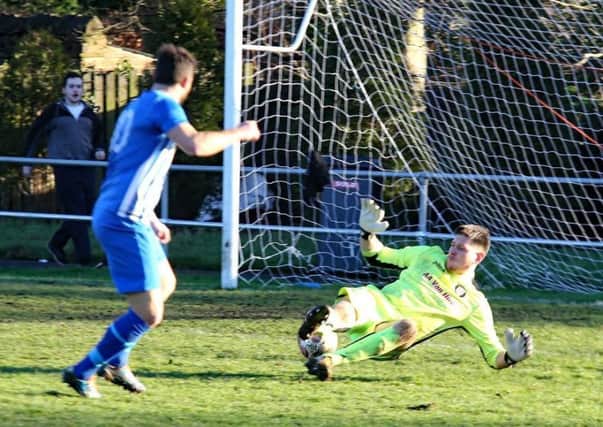 Hallam FC  Hat-trick hero Kieran Watson scores his  first to put them 2-0 up on the stroke of half-time after springing the offside trap. Photo: Ian Revitt